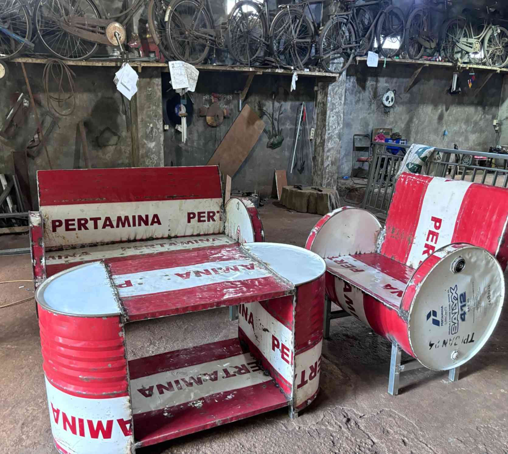 Red chair from recycled oil drums